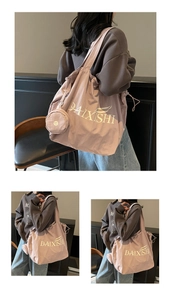Detail of pink canvas tote bag set with drawstring closure and matching mini round coin purse
