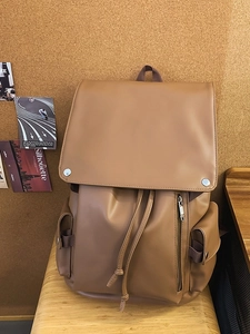 Vintage brown PU leather backpack with drawstring closure and multiple exterior pockets