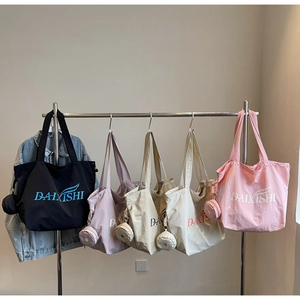 Multi-color large capacity tote bags with matching small round coin pouches on hangers
