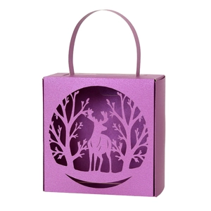 Purple laser-cut Christmas reindeer candy box with forest silhouette and handle