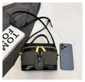 Mini shoulder box bag with black and white weave detail and daily essentials size comparison
