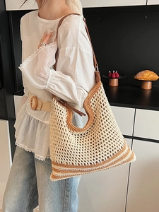 Bohemian woven straw tote bag in beige with brown stripes and leather shoulder strap