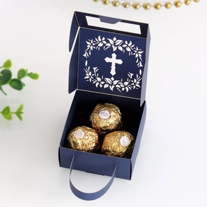 Detail of dark blue hollow cross gift box showing internal capacity and laser cut design