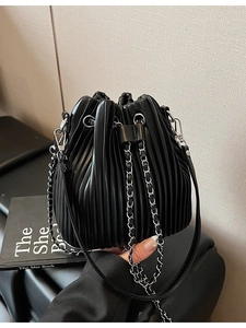 Fashionable black pleated drawstring bucket bag with silver chain strap for women