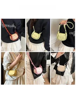 Mini saddle bags in five contrast colors shown on model to demonstrate size and style