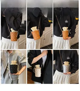 Detail showing various colors of quilted drawstring bucket bags with chain straps