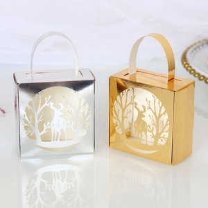 Detail of laser-cut reindeer on gold and silver metallic Christmas candy gift boxes