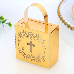 Detailed view of golden gift box with cross hollow design and laurel wreath cutout