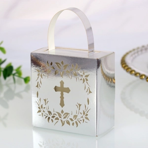 Detailed laser-cut hollow cross and wreath pattern on silver metallic gift candy box