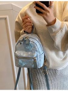 Vintage style light blue butterfly backpack with pleated texture and adjustable straps