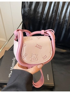 Pink PU leather crossbody saddle bag featuring cartoon bear embossing and lettering