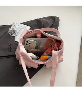 Spacious interior of pink PU leather tote bag with pockets for daily essentials