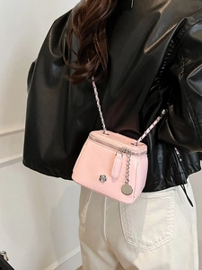 Pink quilted leather vanity case bag with chain strap and camellia metal buckle
