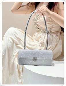 Detail of silver rhinestone shoulder bag with luxury crystal mesh and sleek buckle clasp