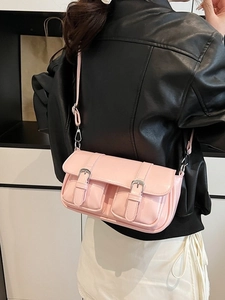 Pink retro crossbody pillow bag with front buckle pockets and adjustable shoulder strap