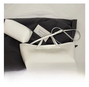 Detailed top view of white tote bag with matching zipper pouch in smooth PU leather