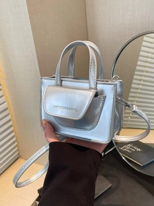 Metallic silver mini crossbody bag with fashion typography and detachable strap