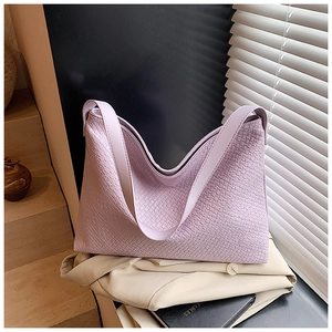 Close-up of purple woven texture and PU leather material on large tote bag
