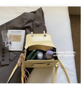 Internal view showing large storage capacity of the lemon yellow crossbody bag with PU leather
