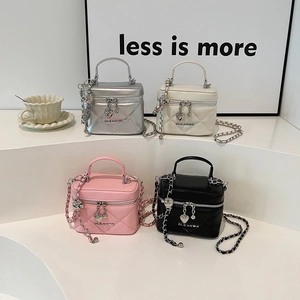Chic quilted mini vanity bags in silver, beige, pink, and black with chain straps