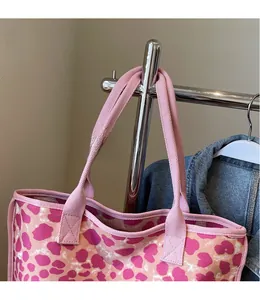 Detailed view of pink leopard print canvas tote bag with comfortable wide shoulder strap