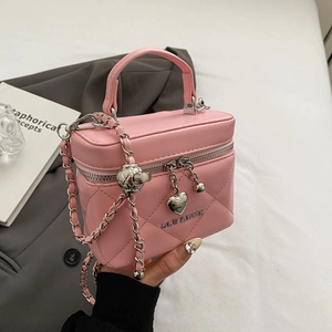Detailed view of pink quilted chain bag with silver heart charms and Gleafun logo
