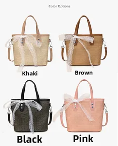 Detail of woven straw bucket bags with lace bows in khaki, brown, black and pink