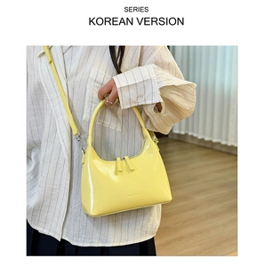 Detailed view of the yellow oil wax leather hobo bag with adjustable strap and dual zippers