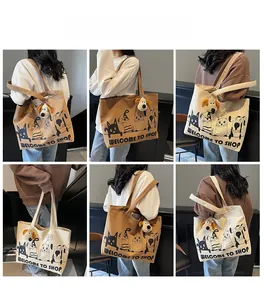 Collage of large canvas tote bags with cartoon prints and plush dog charms shown on models