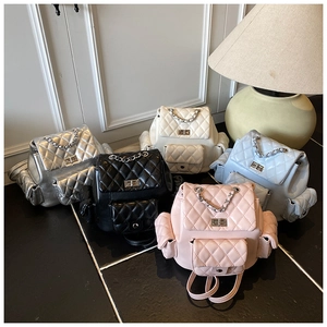 Quilted mini backpacks in silver, black, white, blue, and pink with chain handles