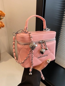 Elegant pink quilted chain bag with heart charm and crossbody strap for women