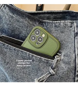 Detail of a denim tote bag exterior zipper pocket for easy phone storage access