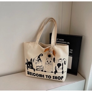 Beige canvas tote bag featuring minimalist cartoon animal prints and a cute plush dog charm