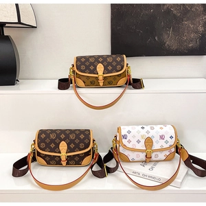 Three vintage crossbody bags in brown and white monogram patterns with gold hardware