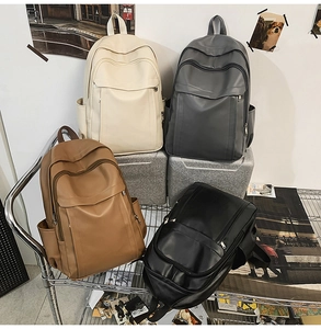 Detailed display of minimalist leather backpacks in four colors for school and work