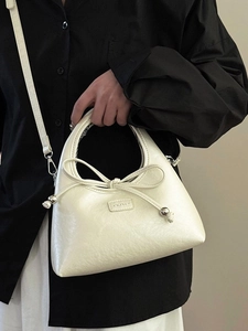 Minimalist cream-white baguette bag with bow detail and silver metal beads for women