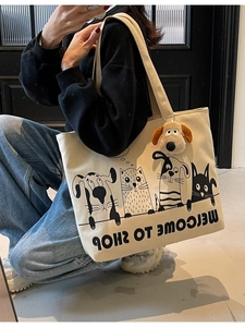 Large capacity beige canvas tote bag with cartoon animals and plush dog charm detail