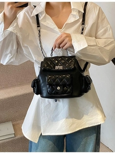 Quilted black backpack with chain straps and diamond pattern in casual style