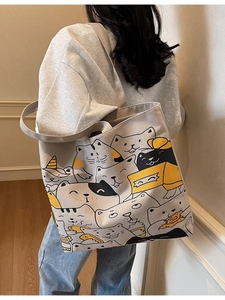 Spacious canvas tote bag with hand-drawn cartoon cat patterns for daily student commute