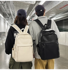 Rear view of models wearing large capacity minimalist PU leather backpacks in black and beige