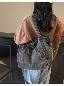 Deep grey vintage canvas tote bag with multi-zipper pockets and wide shoulder strap