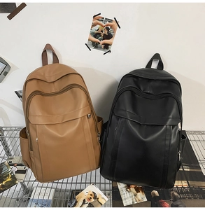 Detail of matte PU leather backpacks in black and brown with dual zipper compartments