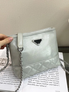 Quilted large bucket bag for women with chain strap in pearlescent light blue finish