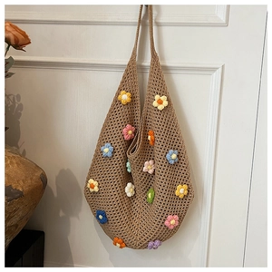 Close-up of colorful 3D crochet flowers and hollow mesh texture on a beige woven bag