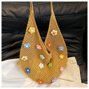 Detail of handmade yellow crochet tote bag featuring multi-color 3D floral embroidery