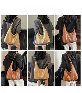 Detail view of khaki and dark brown PU leather hobo bags showing soft texture and straps