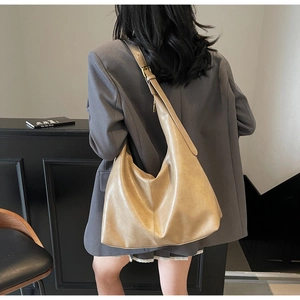 Detail view of large PU leather hobo bag with vintage texture and adjustable strap