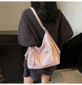 Pink large capacity soft leather tote bag on model showing stylish shoulder carry style