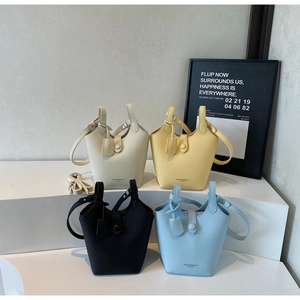 Collection of lychee texture leather bucket bags in white, yellow, black, and blue colors