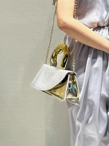 Chic silver rhinestone handbag with golden irregular handle and chain strap for evening